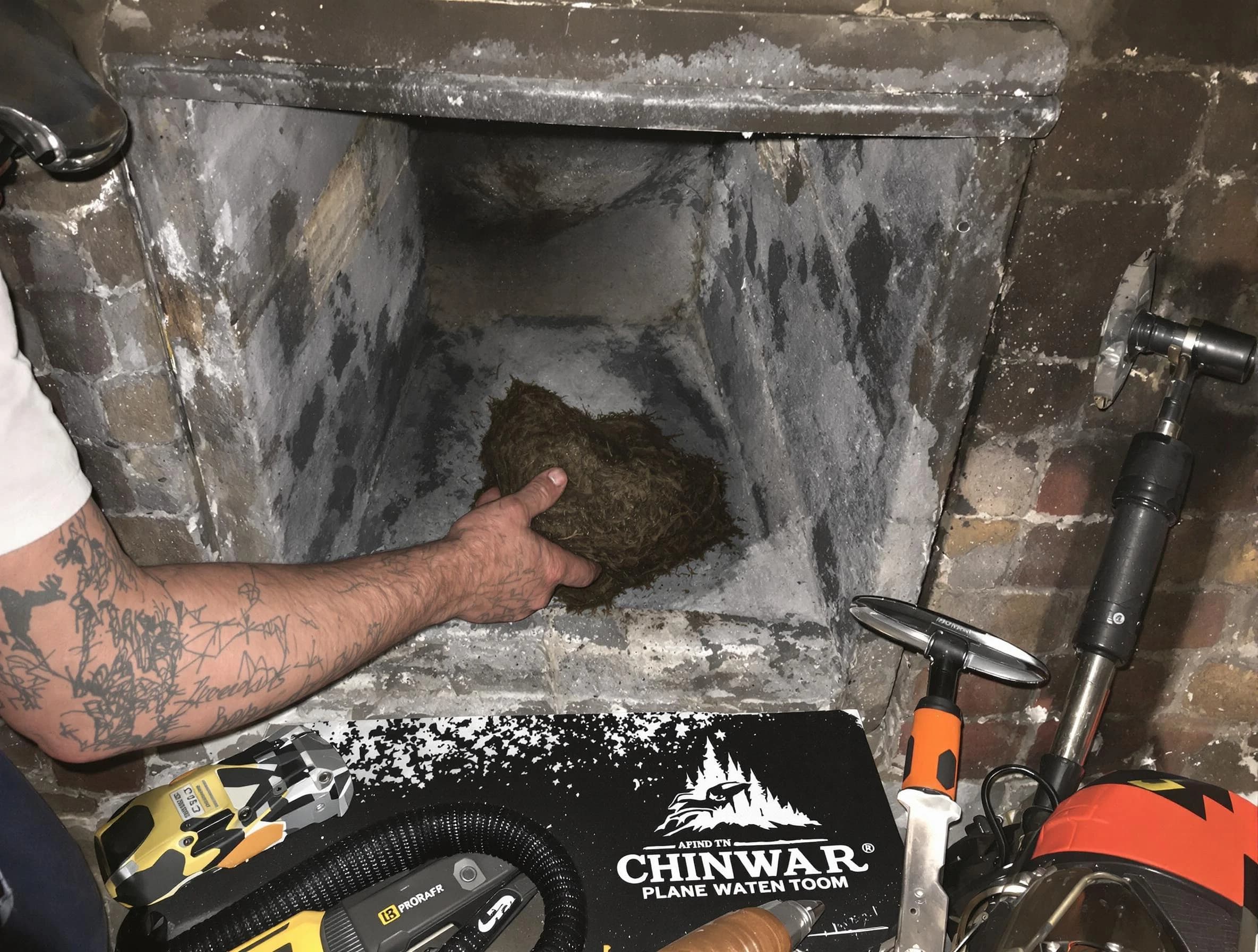 Fort Lee Chimney Sweep safely removing debris and screening chimney in Fort Lee, VA